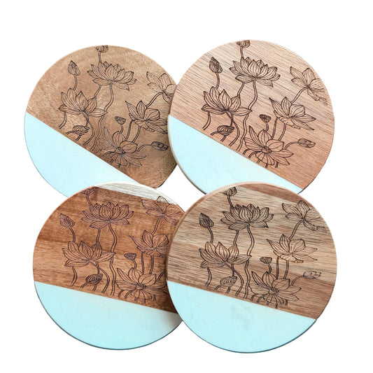 Four wooden coasters with floral patterns