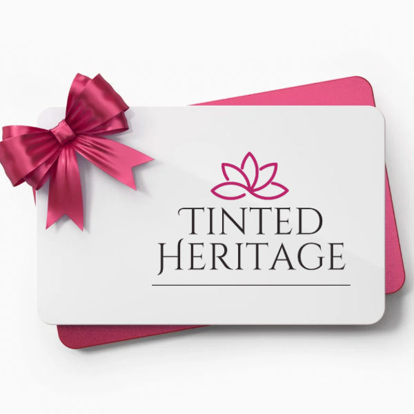 Gift card with 'Tinted Heritage' logo and pink bow on a white background